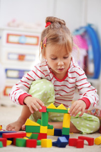 Child Therapy - Child Playing in Playroom